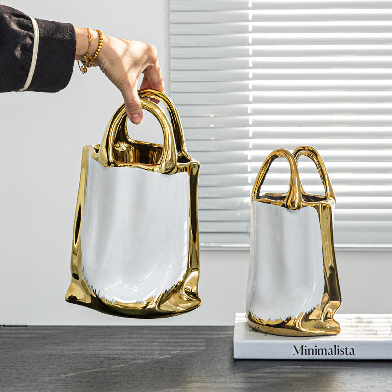 Luxury platinum ceramic tote bag vase with gold handles – large and small sizes
Modern handbag-shaped ceramic vase in white and gold finish
DECASA by VS platinum tote bag vase with flowers