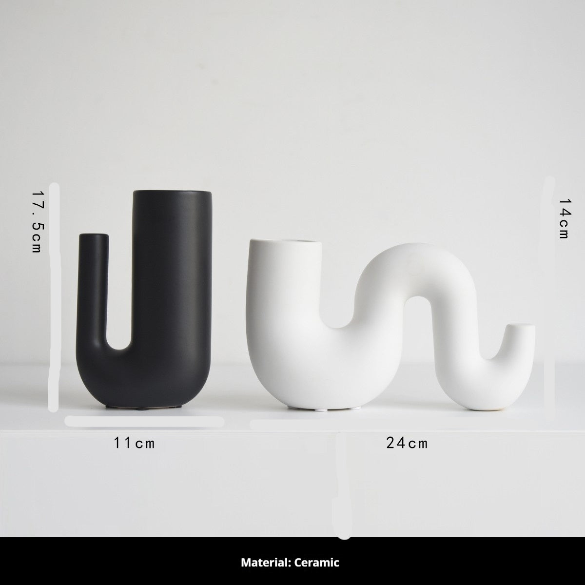 Two ceramic vases, one black and one white, with measurements on a light gray background.