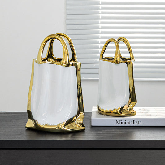 Luxury platinum ceramic tote bag vase with gold handles – large and small sizes
Modern handbag-shaped ceramic vase in white and gold finish
DECASA by VS platinum tote bag vase with flowers