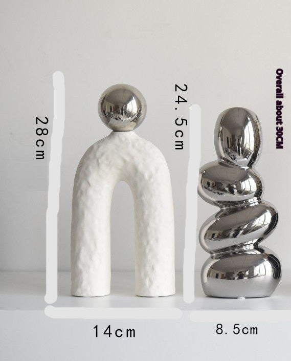 Two decorative sculptures with measurements indicated on a light gray background