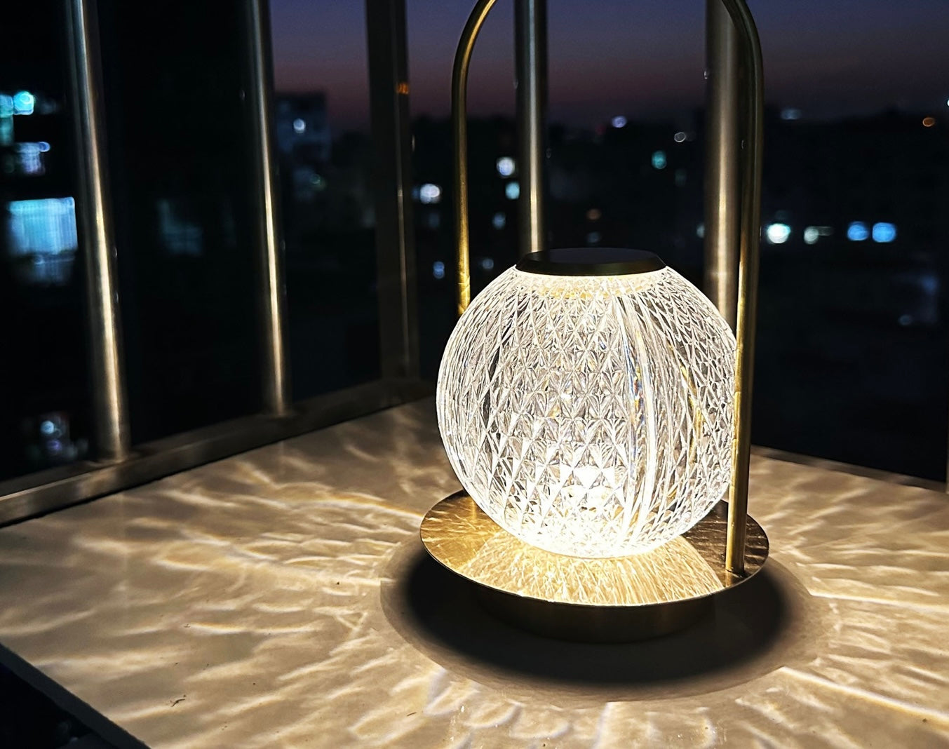 Decorative lamp with textured design on a surface at night